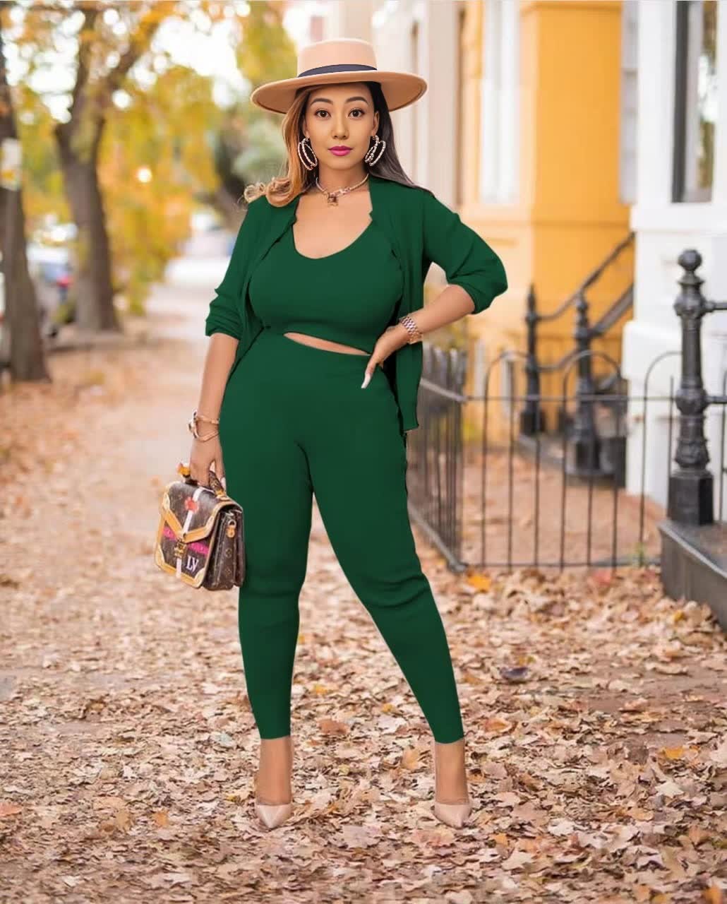 Dark green knit three-piece set: cropped top, open cardigan, and capri pants