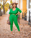 Lime-green knit three-piece set with cropped top, cardigan, and fitted capri pants