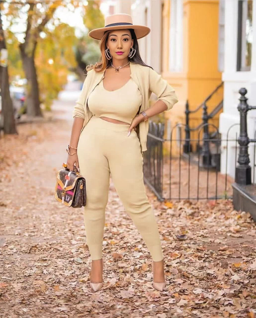 Beige knit three-piece set with cropped top, cardigan, and fitted capri pants