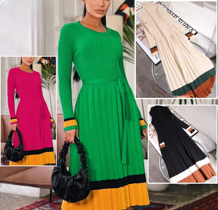 Green knit maxi dress with colorblock striped cuffs and pleated skirt hem
