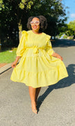 Yellow midi ruffle-tier dress with loose fit and bow detail at waist