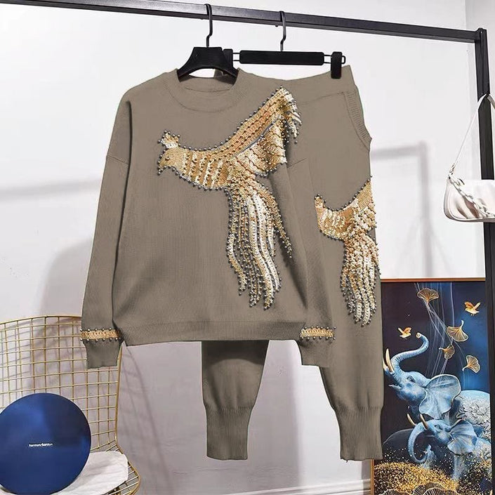 Khaki knit twin set with gold sequin bird motif on long-sleeve top and matching pants