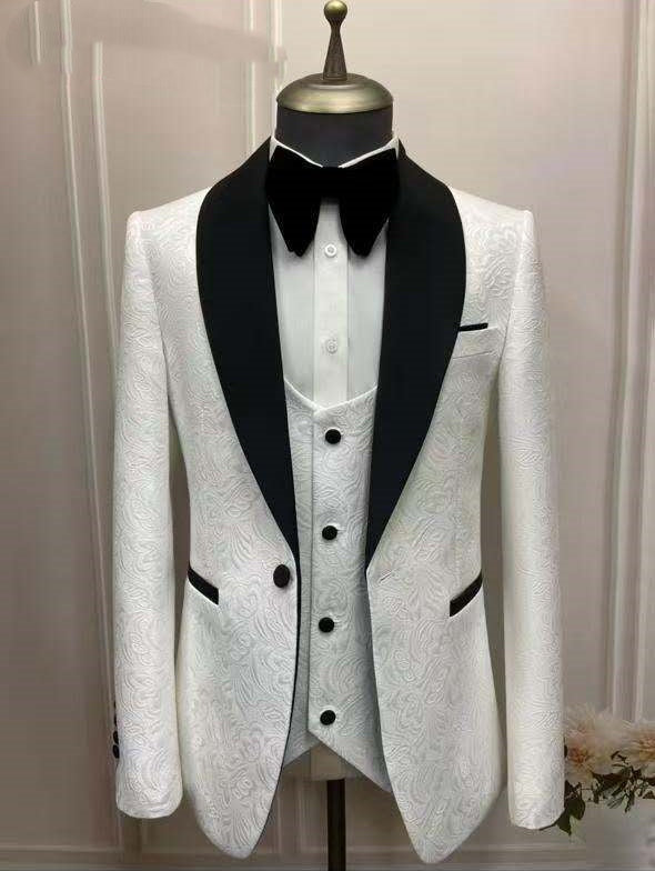 White jacquard three-piece suit with black shawl lapels and buttoned vest, formal wedding style