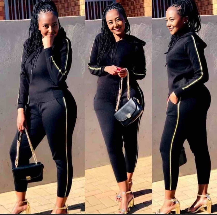 Sporty zippered hoodie paired with striped long pants, perfect for casual athletic wear