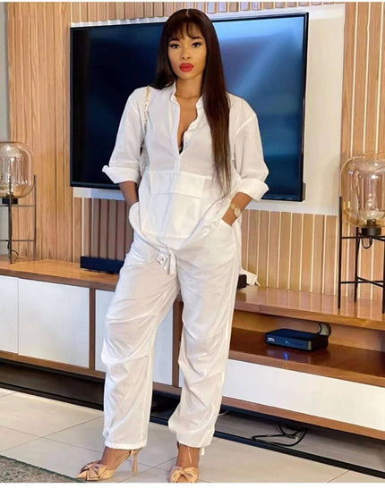 White solid color jumpsuit with front placket and drawstring waist, long sleeves