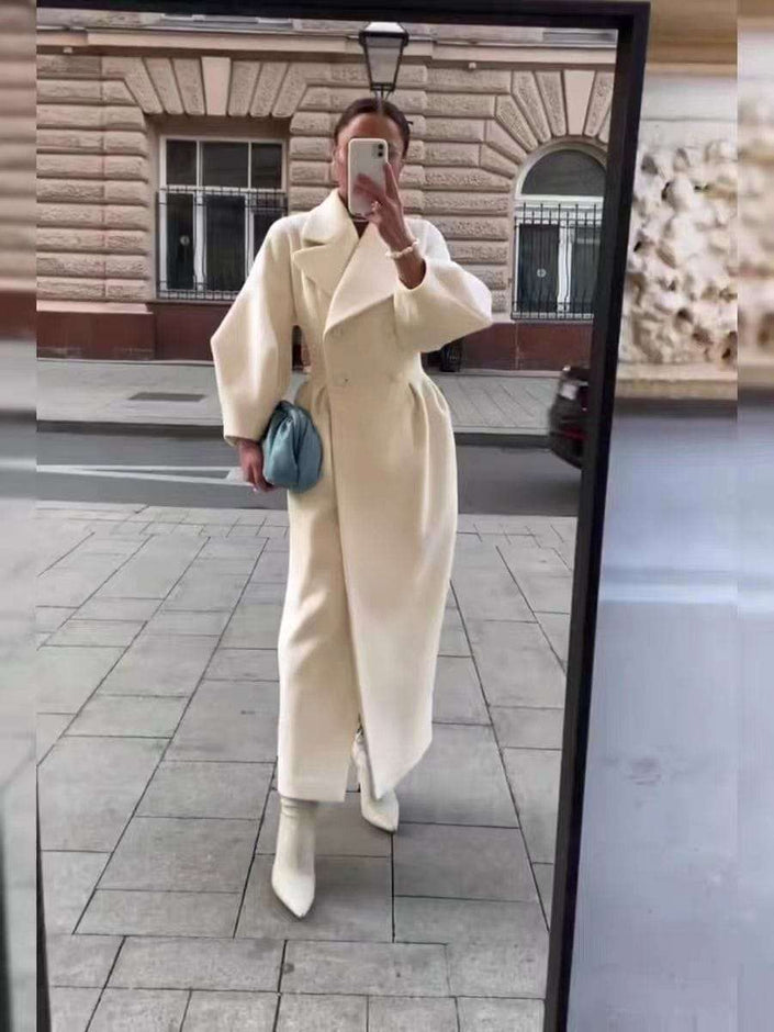 Beige belted oversized coat with wide lapels and long sleeves