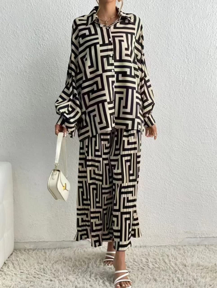 Long geometric-pattern shirt with button front, pointed collar, and long sleeves
