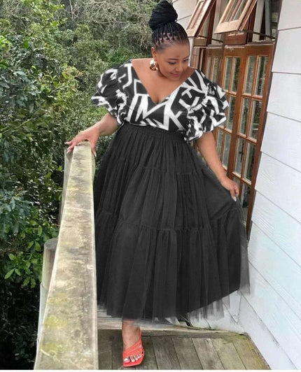 Black tiered tulle maxi dress with puff sleeves and V-neck patterned trim