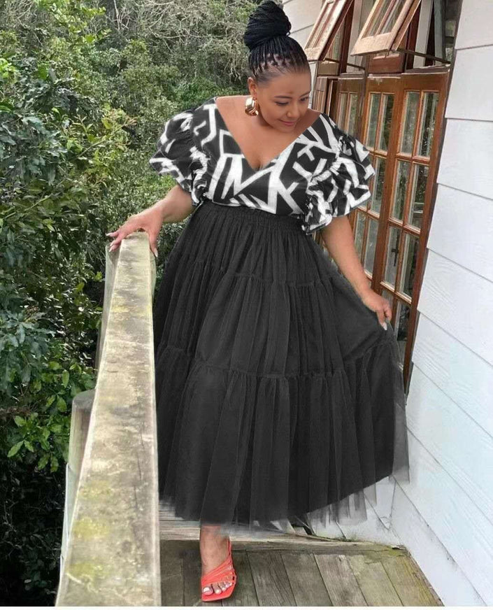 Black tiered tulle maxi dress with puff sleeves and V-neck patterned trim