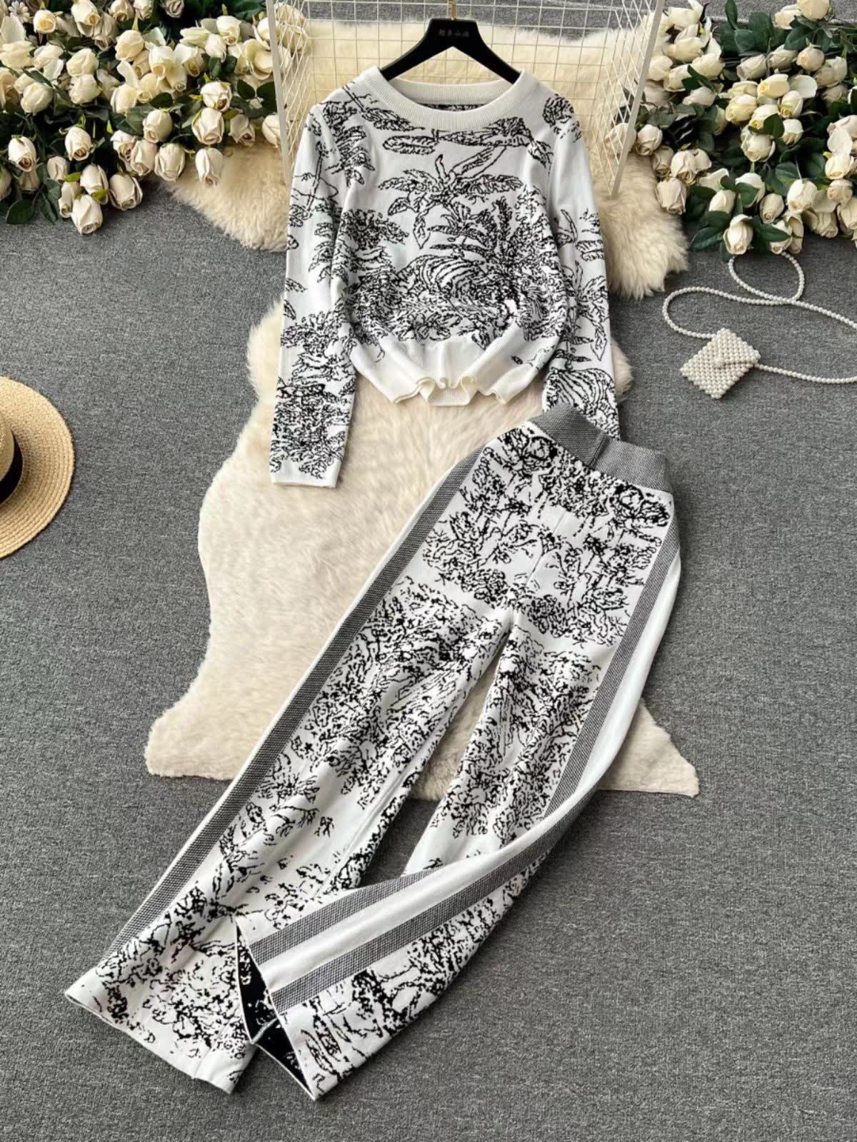 Botanical printed two-piece set: white long-sleeve top and wide-leg pants, black contrast trim