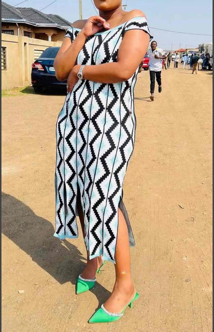 Off-shoulder geometric knit midi dress, sleeveless; black/white with blue diamond pattern