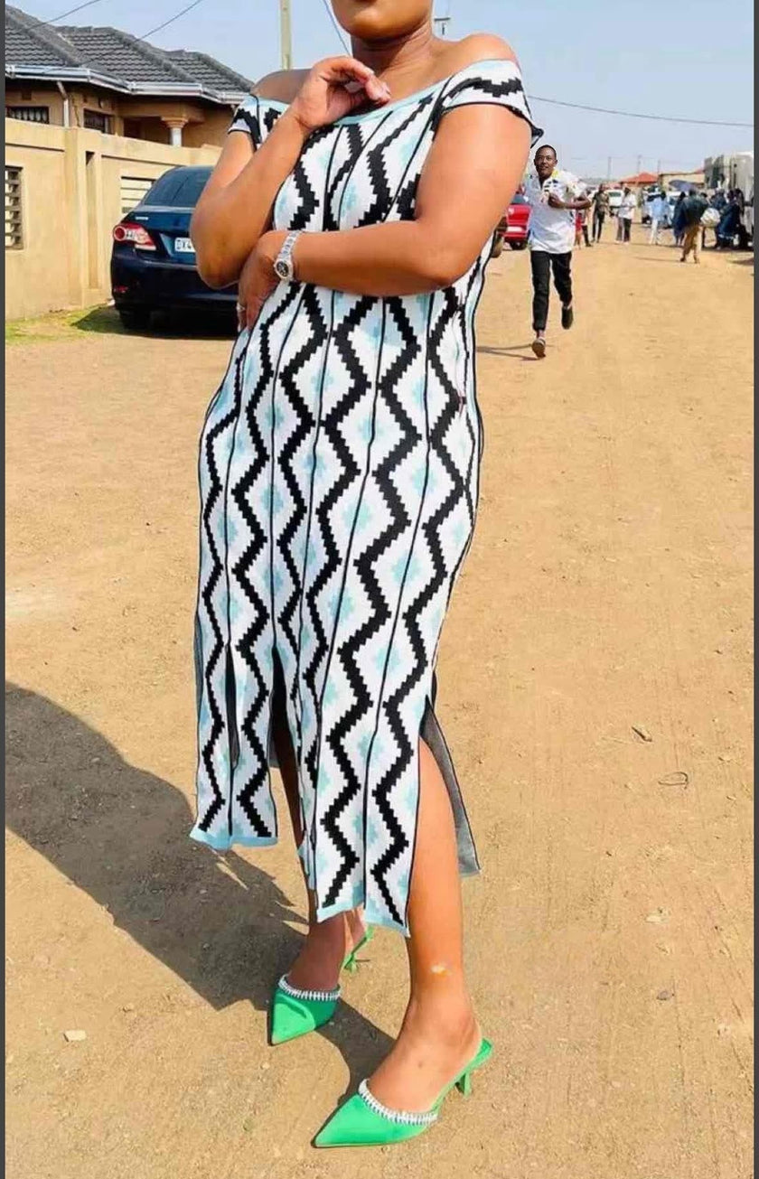 Off-shoulder geometric knit midi dress, sleeveless; black/white with blue diamond pattern