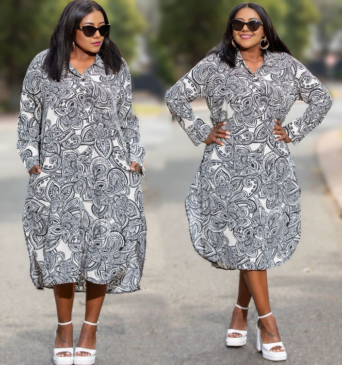 Printed midi dress with long sleeves, button front, and side pockets, in black and white