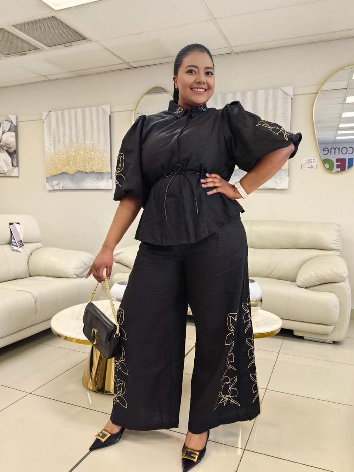 Black wide-leg pant set with puff sleeves and floral vine embroidery on the legs