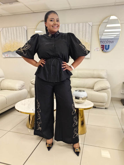 Black puff-sleeve blouse and wide-leg pants twin set with floral embroidery
