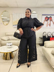 Black puff-sleeve twin set with floral embroidery wide-leg pants, cinched waist blouse