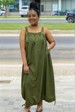 Army-green utility maxi dress with square neckline, front pockets, and drawstring hem
