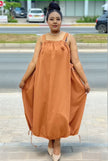 Brown-orange utility maxi dress with square neckline and adjustable shoulder straps