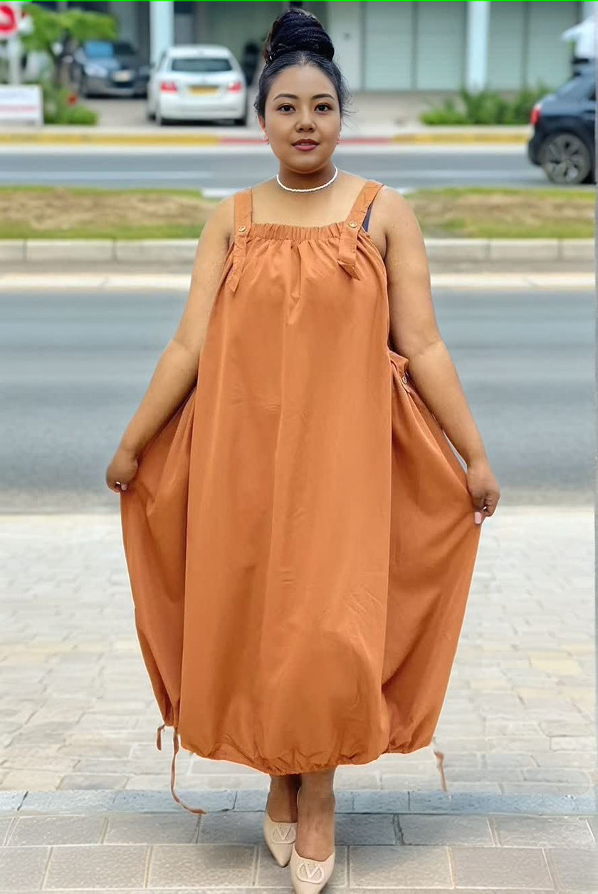 Brown-orange utility maxi dress with square neckline and adjustable shoulder straps