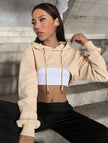 Beige off-shoulder cropped hoodie with drawstring hood and long sleeves
