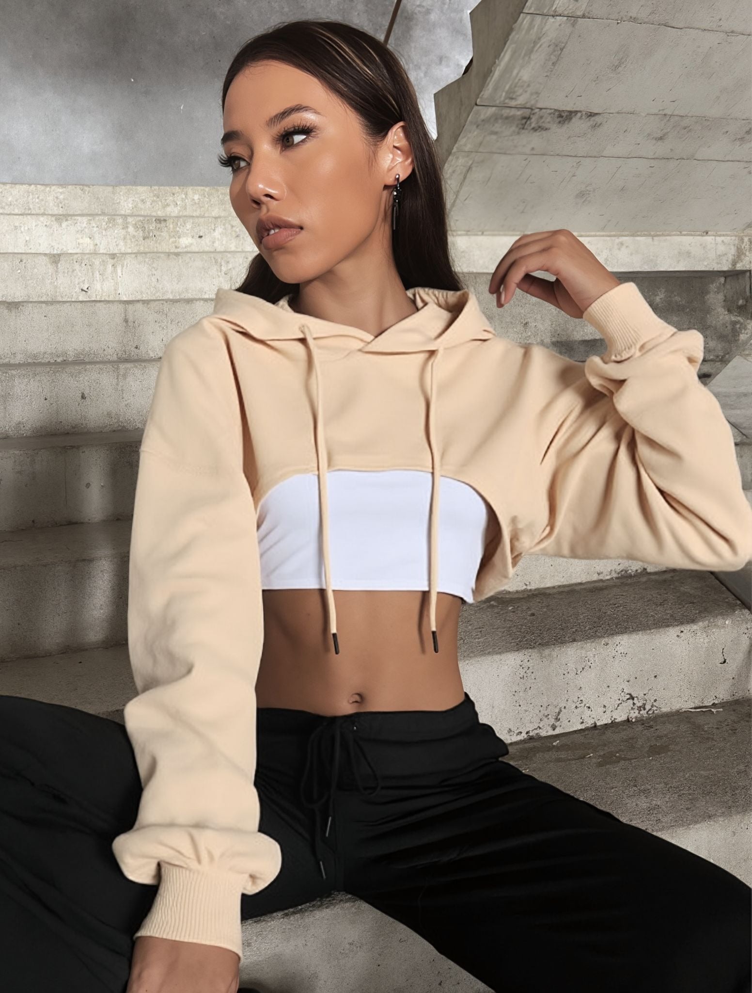 Beige off-shoulder cropped hoodie with drawstring hood and long sleeves
