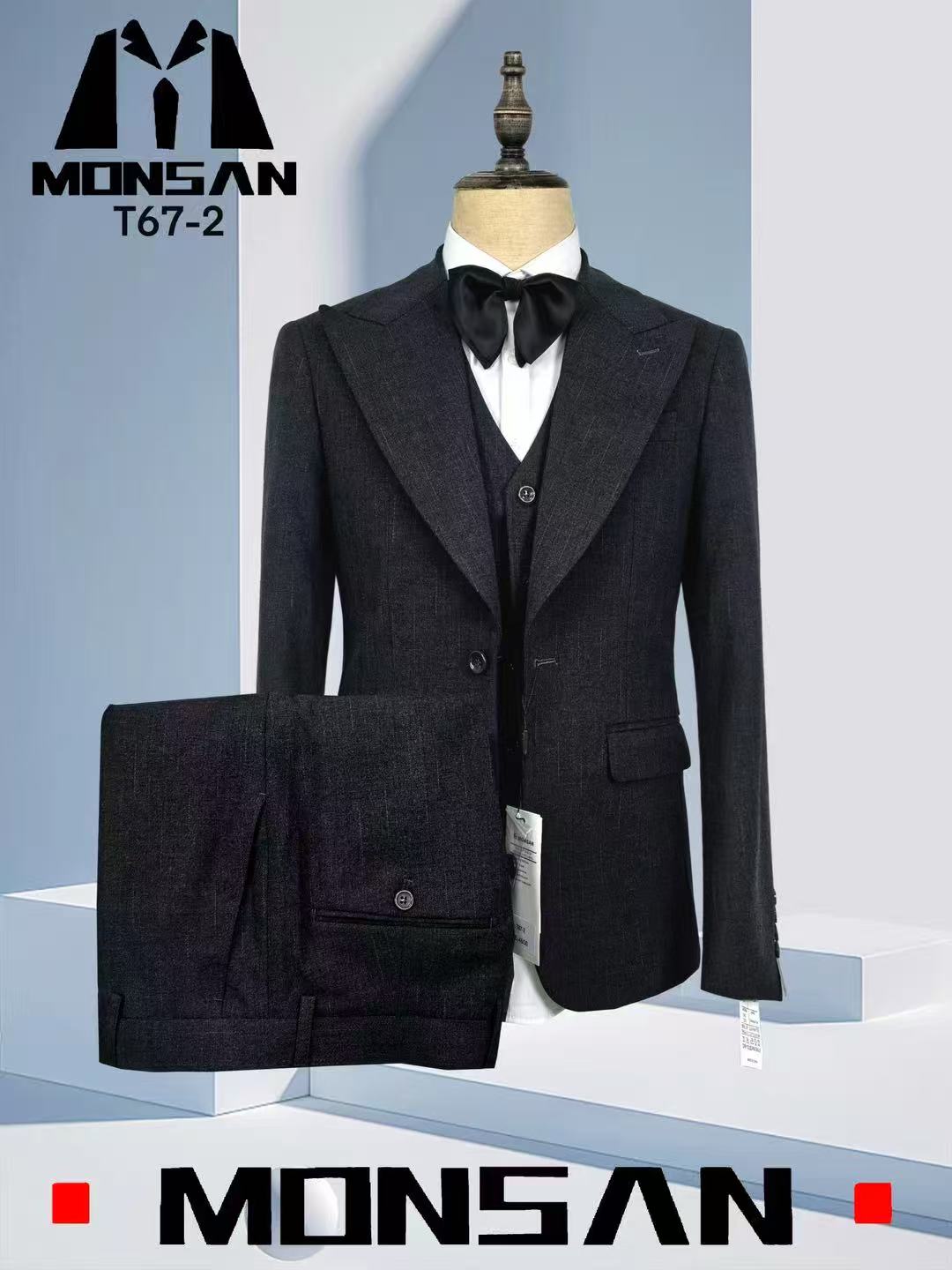 Dark grey men’s suit jacket with peak lapels and matching trousers, button front