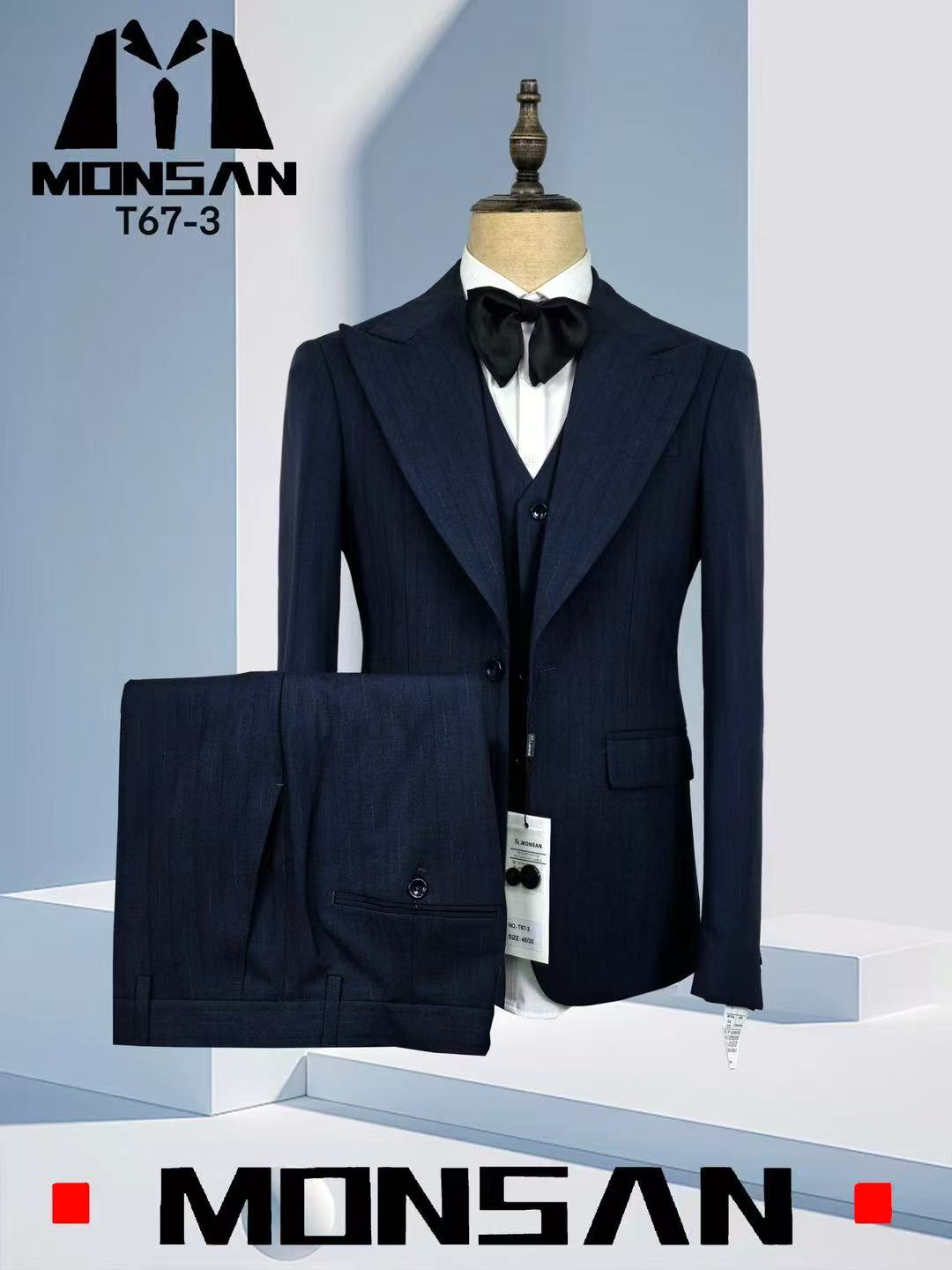 Navy pinstripe three-piece suit with peak lapel jacket, vest, and matching trousers