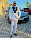 White tuxedo suit with rhinestone shawl lapels, black glitter trim and matching trousers