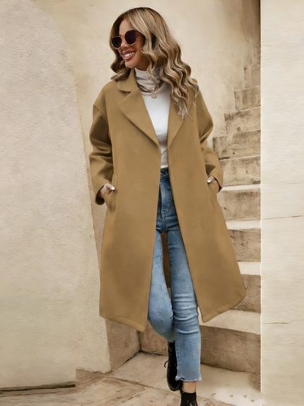 Beige minimalist long coat with notched lapels, button front, and side pockets