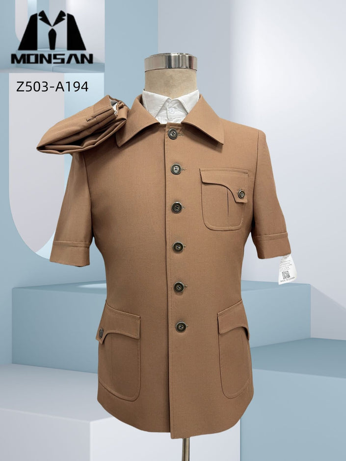 Tan safari suit jacket with short sleeves, button front, chest pocket, flap side pockets